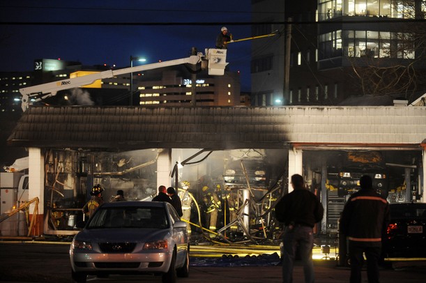Ann Arbor firefighters work to put out a fire at Broadway Auto Care on Monday night. Melanie Maxwell I AnnArbor.com